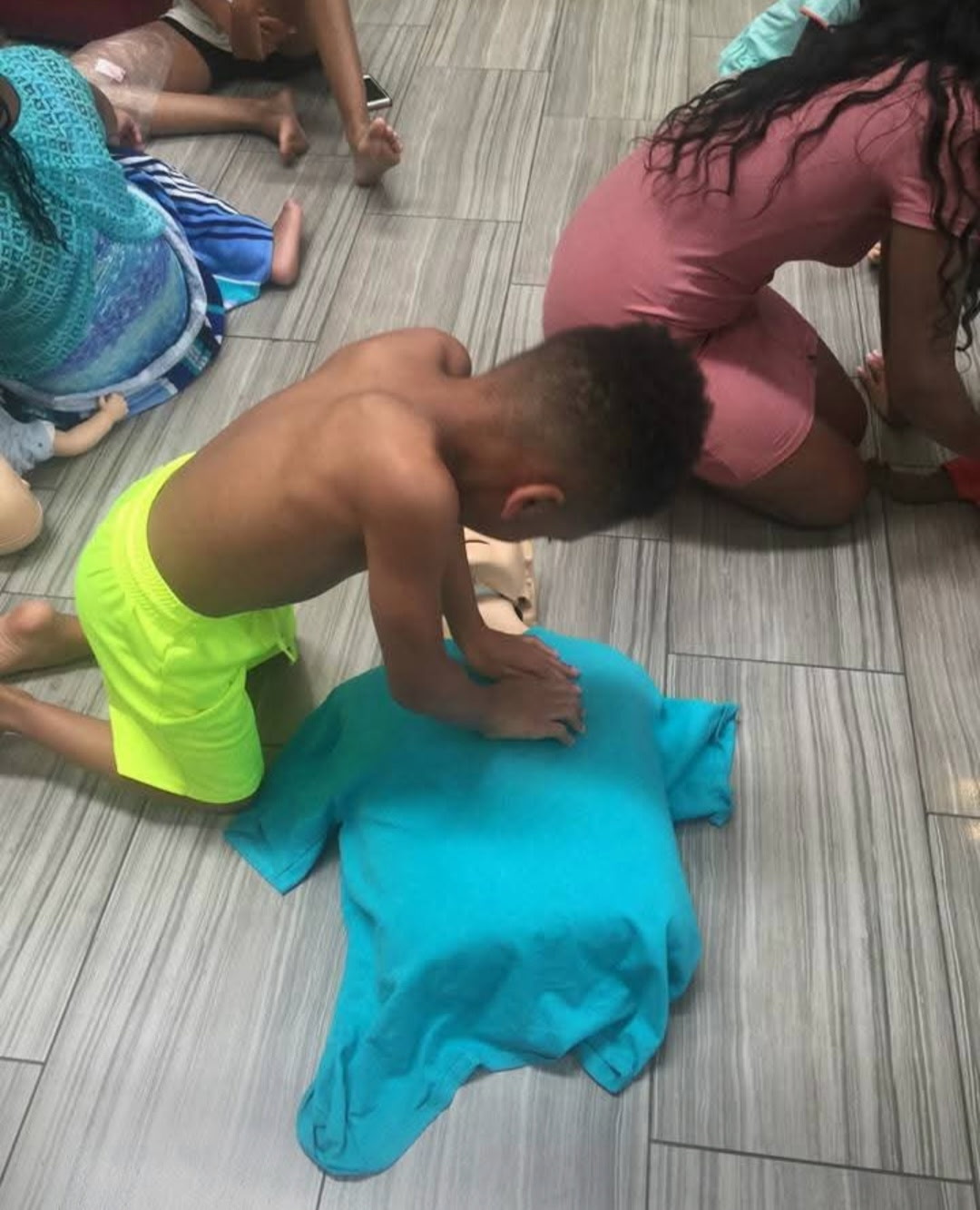 Students practicing infant and pediatric CPR skills